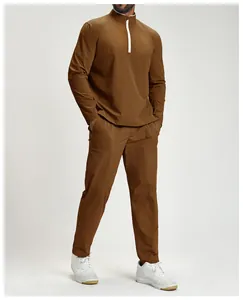 Detailed view of a brown men's recycled athletic set with a 1/4 zipper on a model