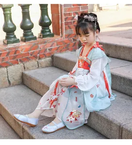 Detail view of girl's embroidered Hanfu shoes in light blue and white fabric design