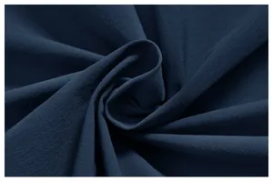 Close-up of premium dark blue quick-dry outdoor fabric texture for men's sports jacket