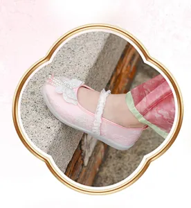 Close-up of pink Hanfu embroidered shoes for girls featuring a 3D butterfly and pearls