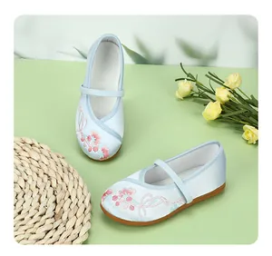 Detailed view of children's blue embroidered Hanfu shoes with pink floral pattern