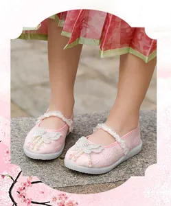 Detailed view of pink Chinese style Hanfu shoes for girls with pearl butterfly charms