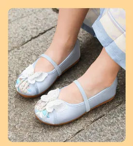 Close-up of girls' Hanfu shoes featuring elegant butterfly and floral embroidery.