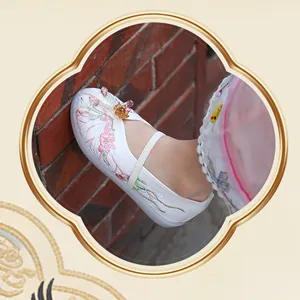 Close-up of traditional white silk Hanfu embroidered shoes for girls with floral patterns