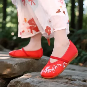 Traditional red embroidered Hanfu shoes for girls with floral patterns and a strap