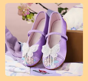 Detailed view of purple Hanfu shoes for girls with butterfly and pearl embroidery