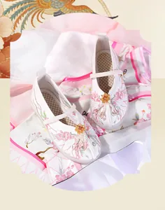 Detailed view of white Hanfu embroidered shoes for girls with pearl floral beads