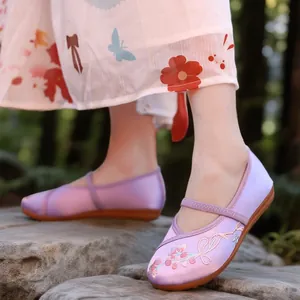 Elegant traditional purple embroidered Hanfu shoes for girls featuring floral patterns