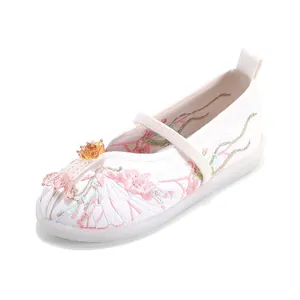 Traditional Hanfu embroidered satin shoes for girls with floral patterns and beads.