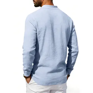 Back view of a light blue long-sleeved linen polo shirt with a relaxed fit for men.