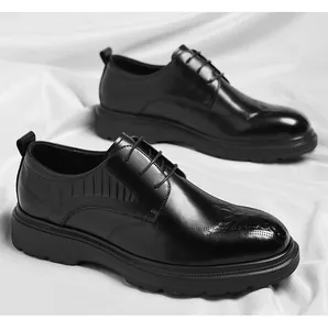 Detailed shot of premium black crocodile embossed men's formal leather oxford shoes.