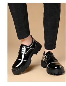 Men's British style platform glossy leather shoes on model, black with white accents