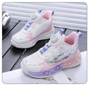 Detailed macro view of girls' white and pink running shoes with heart pattern and rotary buckle