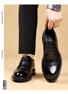 Detail of black embossed brogue leather shoes for men's business and formal wedding wear.