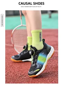 Breathable kids sports shoes for badminton with a convenient knob lacing system in action