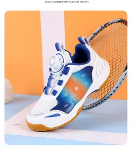 Detailed view of youth badminton shoes with a rotating dial lace and breathable mesh upper