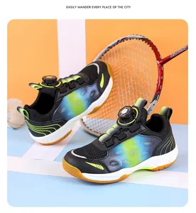 Detailed view of youth badminton shoes featuring a rotary buckle and gradient color design