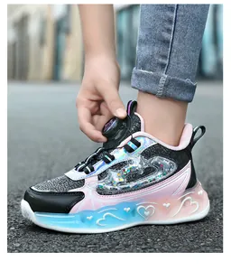 Detail of girls' princess style running shoe with rotary dial and LED lights