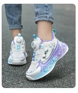 Close-up of girls' purple and white light-up sneakers worn on an outdoor asphalt road