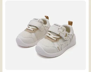 Close-up of breathable mesh toddler shoes with cute cartoon cat and Velcro strap