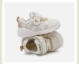 Detail of breathable mesh toddler walking shoes with a cute cartoon cat design