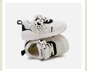 Detailed view of white cartoon cat toddler shoes with breathable mesh and velcro strap