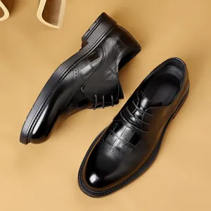 Elegant men's black leather brogue dress shoes featuring classic embossed textures