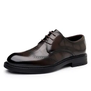 Men's brown business dress shoes with embossed Brogue patterns and lace-up design
