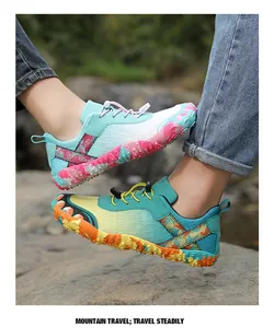 Close-up of colorful non-slip outdoor hiking shoes with reinforced toe protection.