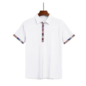 Close-up view of white men's polo shirt with Navaho contrast trim on placket and cuffs