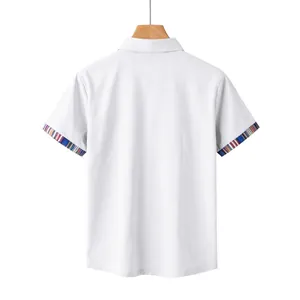 Back view of a white men's polo shirt with colorful Navajo patterned cuffs