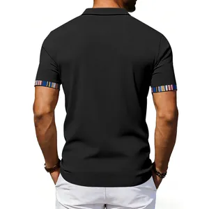 Back view of men's black polo shirt featuring colorful Navajo-style striped cuffs.