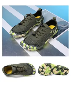 Macro view of olive green hiking shoe with camouflage sole and quick-lace system