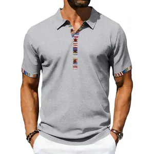Detailed view of a gray men's polo shirt with colorful Navajo-style patterned trim.