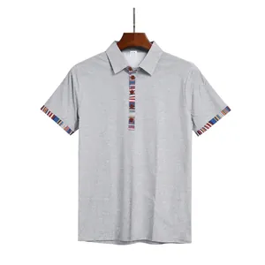 Front view of grey men's Polo shirt with Navajo striped contrast cuffs and placket