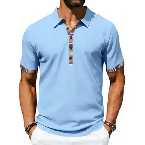 Detail of Navajo-style striped placket and cuffs on light blue men's polo shirt