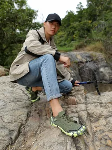 Professional non-slip outdoor hiking shoes for men and women on rocky terrain.