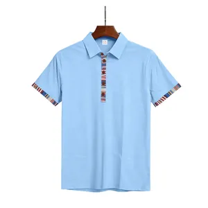 Close-up of light blue polo shirt with Navajo pattern trim on collar and cuffs