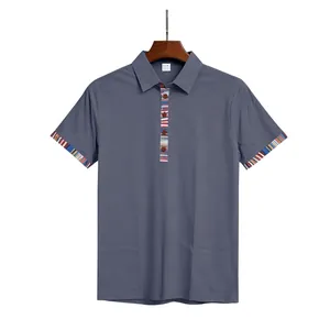 Detail view of men's short sleeve Polo shirt with Navajo striped cuffs and placket.