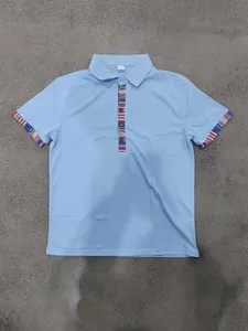 Detailed view of light blue men's polo shirt featuring Navajo pattern ethnic accents