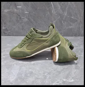 Side view of vintage olive green GAT sneakers with suede texture and gum rubber sole