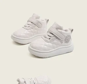 Detail of off-white quilted high-top baby sneakers with star logo and velcro strap