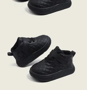 Close-up detail of black quilted leather high-top toddler shoes for babies and infants