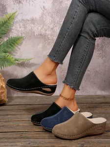 Cozy fur-lined wedge mules in black, blue, and tan colors for autumn and winter.