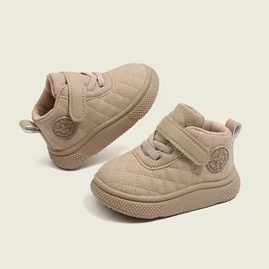 Beige high-top baby walking shoes featuring quilted pattern and soft anti-slip rubber sole