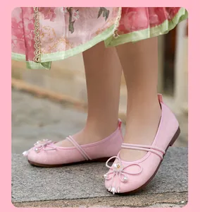 Close-up of pink breathable mesh Hanfu shoes for girls with decorative floral details.