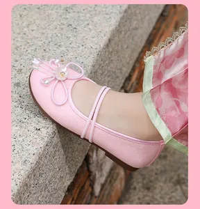 Detailed view of pink glittery Mary Jane Hanfu shoes with pearl flower for girls