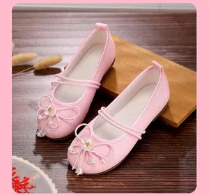 Detail of pink glitter Hanfu flat shoes with delicate flower and pearl decorations