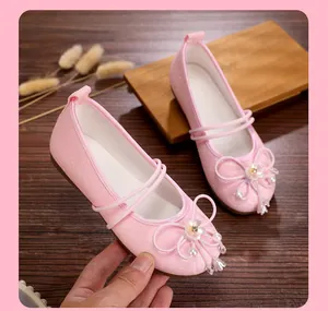 Close-up of pink breathable mesh Hanfu flat shoes with delicate flower decoration