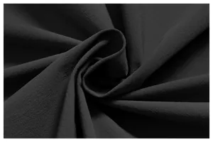 Gros plan de la texture du tissu noir respirant à séchage rapide pour veste de sport
